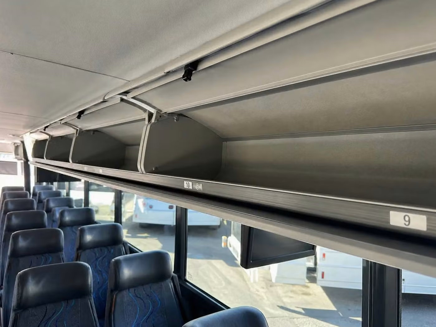fort wayne 56 passenger charter bus overhead storage